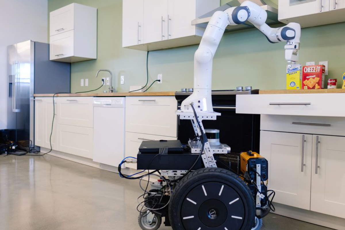 An Image Featuring Collaborative Robots Cooking & Cleaning The Kitchen.