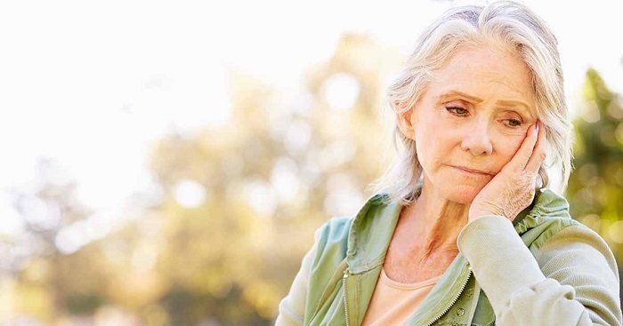 Sad Depressed Senior Womansuffering From Stroke.